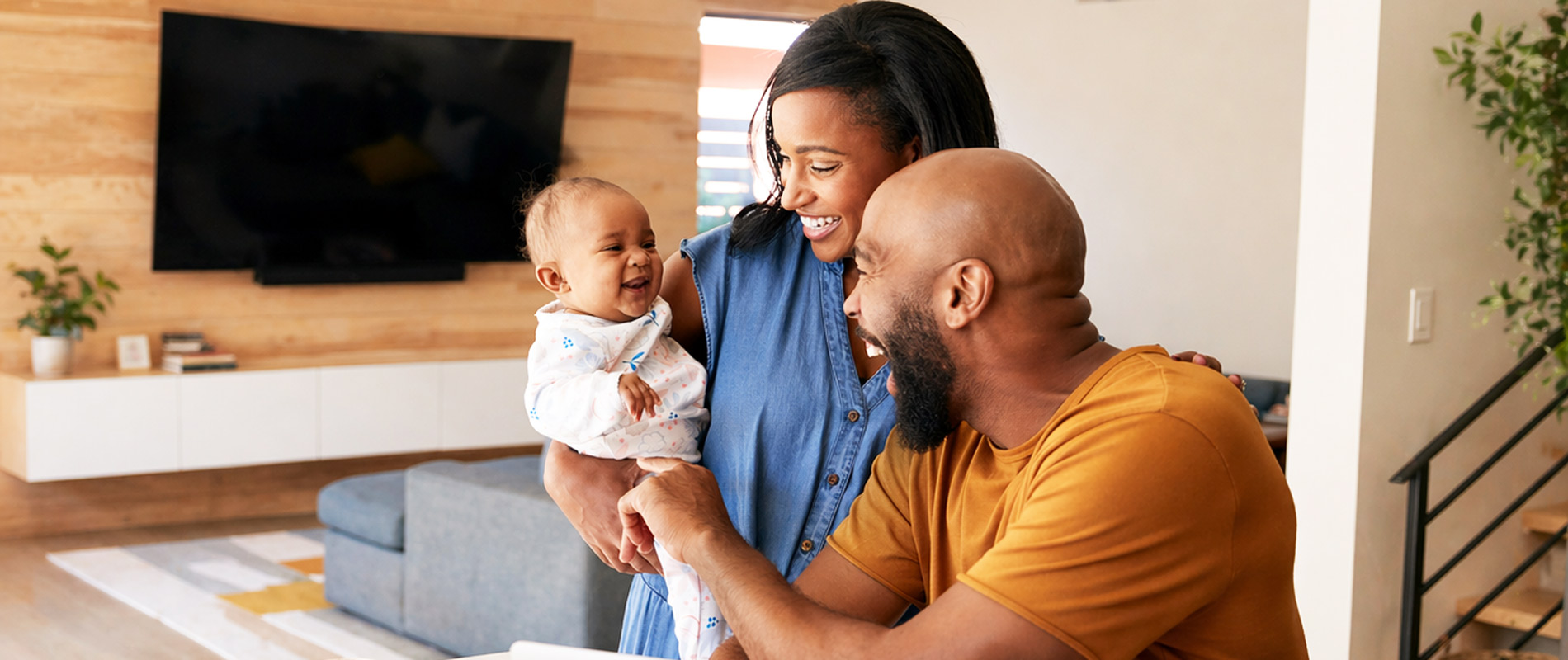 Happy couple holding getting ready for first day of daycare