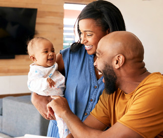 Happy couple holding getting ready for first day of daycare
