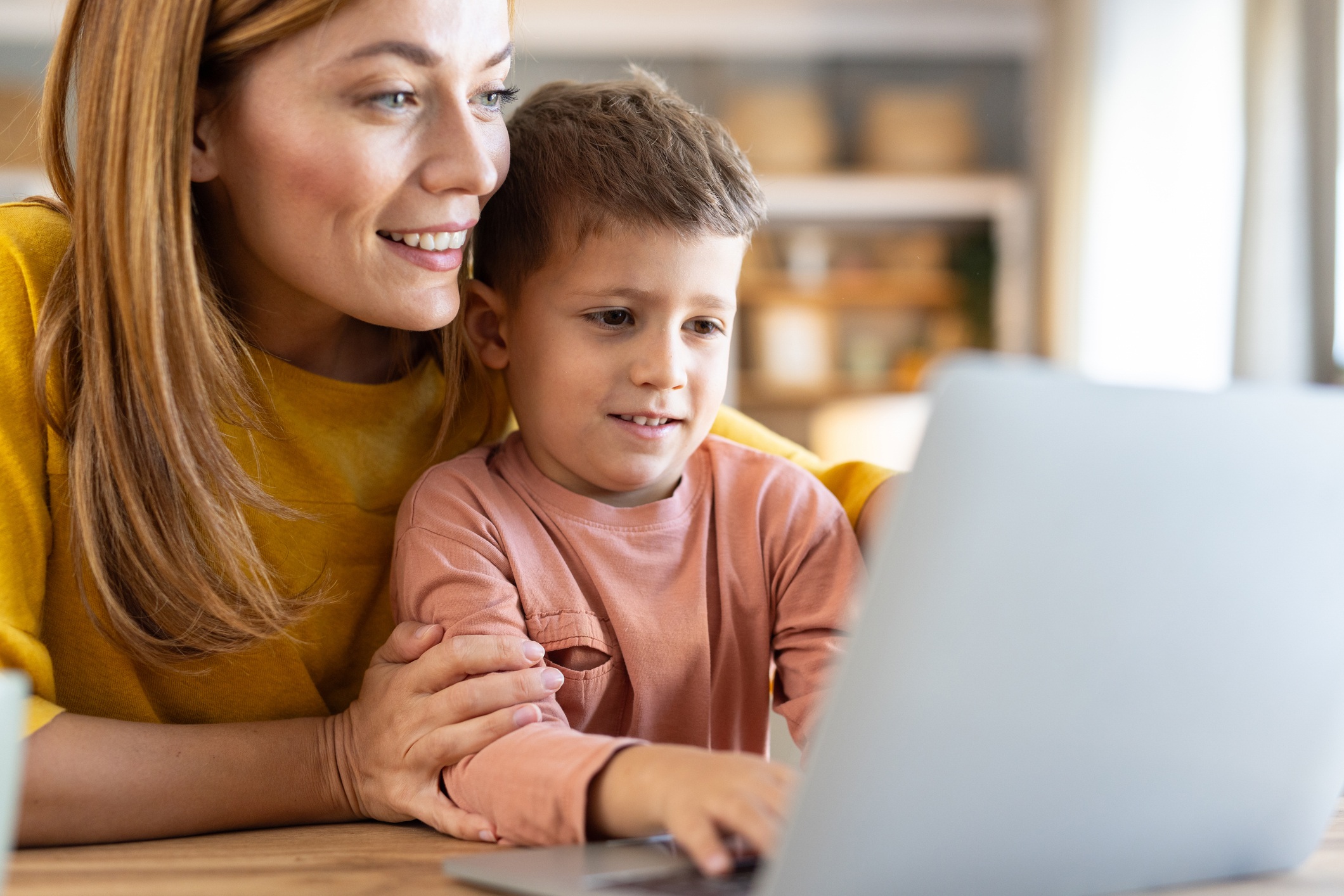 Parent with Child at Computer Smiling