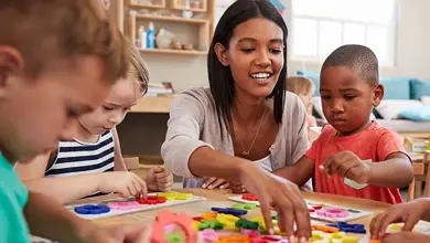 Teacher with group of students working with puzzles